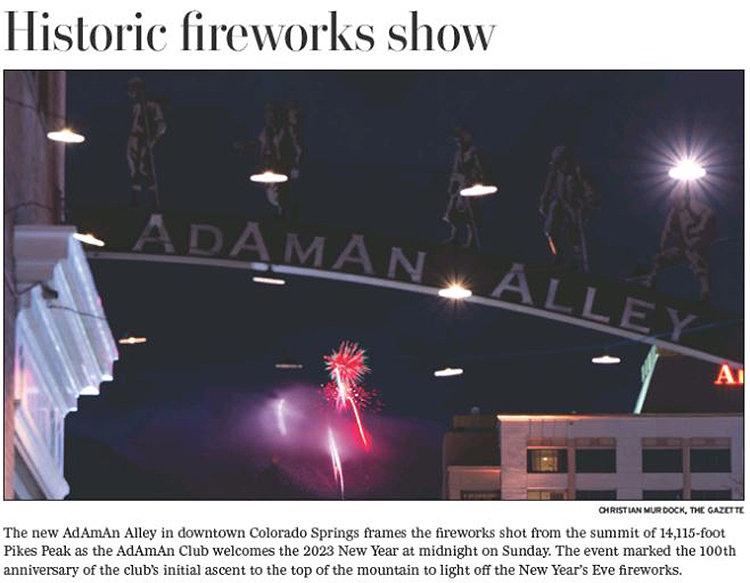 an article clipping with a photo of several fireworks in the sky on new year's eve viewed from below the adaman alley arch
