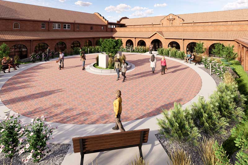 Rendering of the Valley-Wide Health & Wellness Center courtyard, featuring a modern, open-air space with seating areas, landscaping, and large windows that connect to the building’s contemporary exterior. The design promotes relaxation and community well-being.