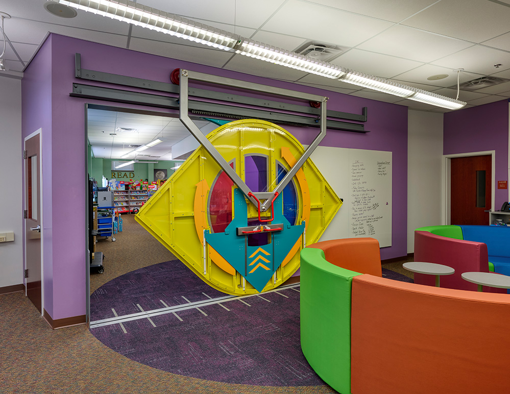 mcauliffe elementary steam door, partway closed