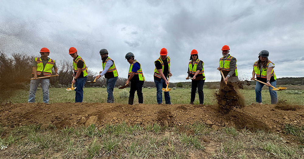 group of people pose at the three springs elementary groundbreaking ceremony