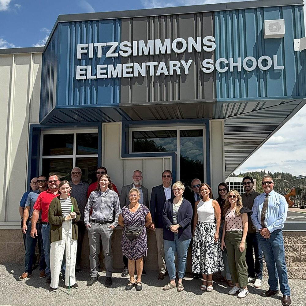 group of people in front of newly renovated Fitzsimmons Elementary School