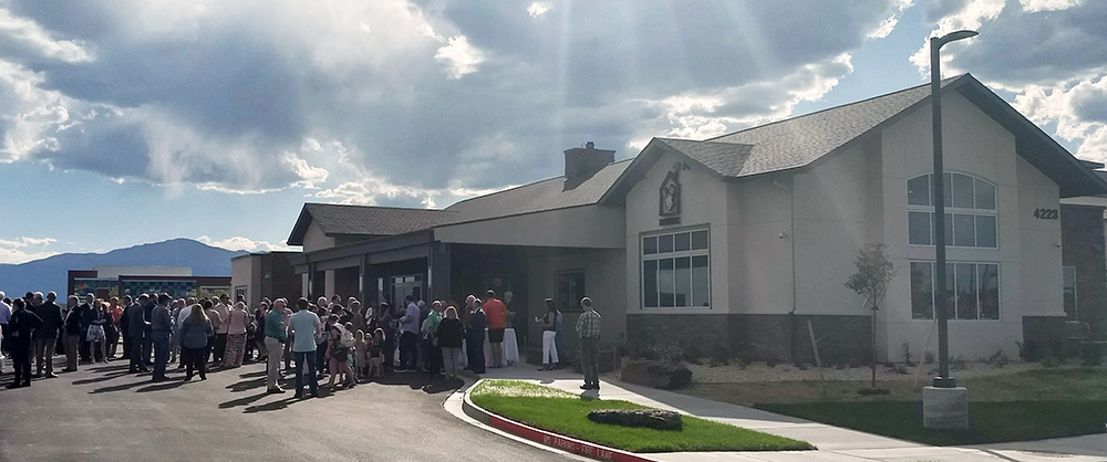 crowd gathered for the Ronald McDonald House ribbon cutting